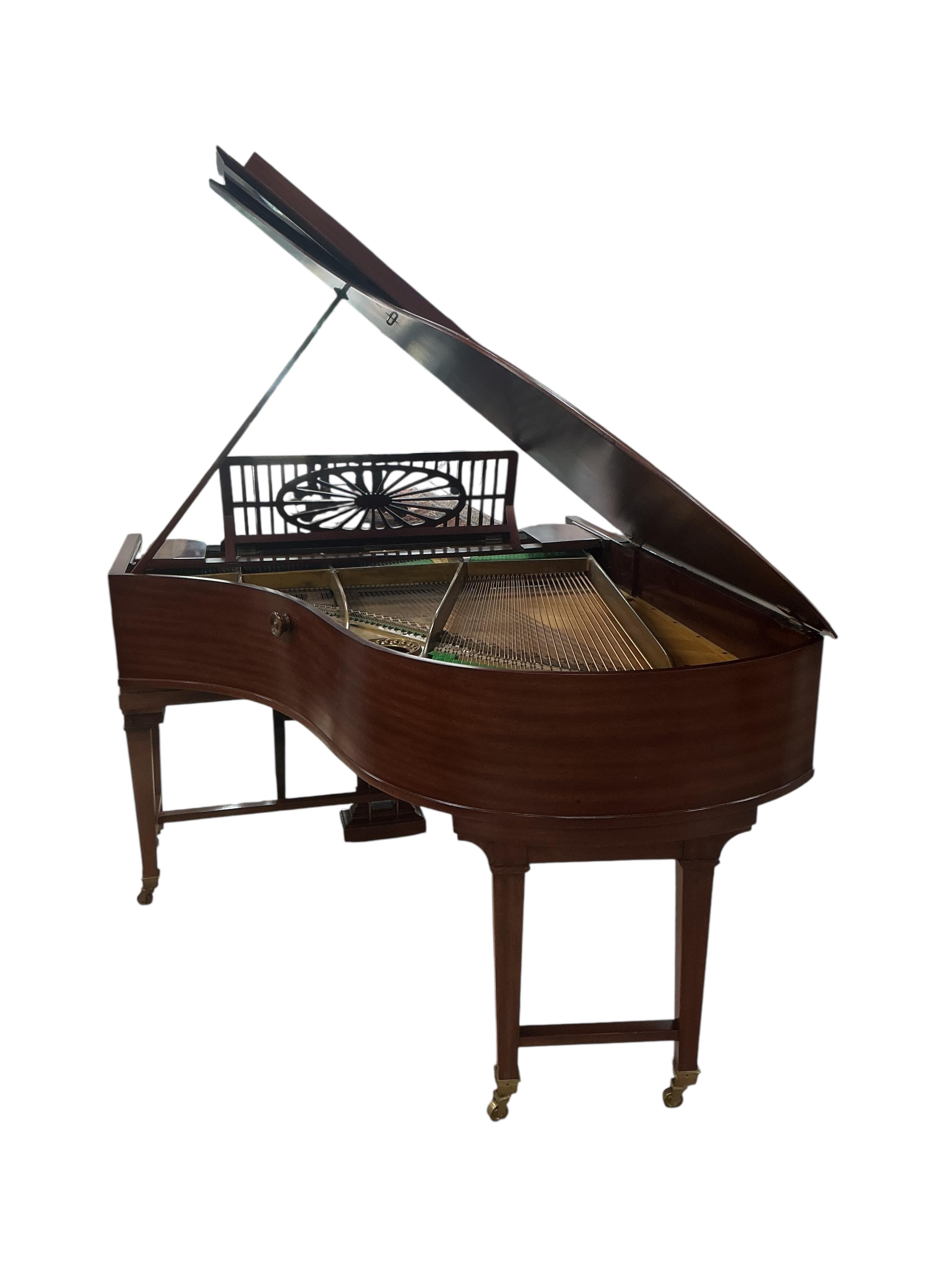 A Bechstein mahogany cased boudoir grand piano, model A, number 96003 (c.1910). Recently restrung, new felt to hammers and case re-polished, together with an adjustable ebonised piano stool. Length 182cm, depth 144cm.